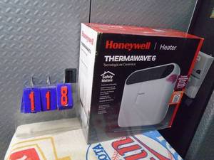 lot 118 image: New Honeywell thermal wave electric heater. As shown.