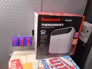 lot 122 image: New Honeywell thermal wave electric heater. As shown.