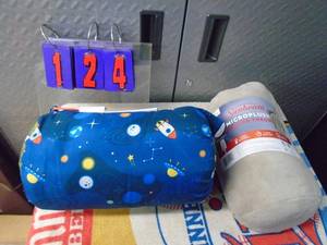 lot 124 image: Sunbeam micro plush heated throw & kids sleeping bag. As shown.