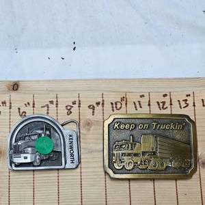 lot 57 image: Kenworth and Truckin Belt Buckles