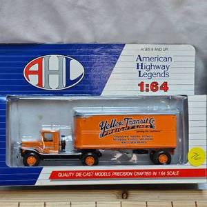 lot 76 image: Yellow Transit Die Cast 164 scale and Ertl Case Truck