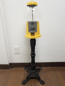 lot 3 image: 1980s CAROUSEL Industries Yellow Gumball Machine on Cast Iron Stand.