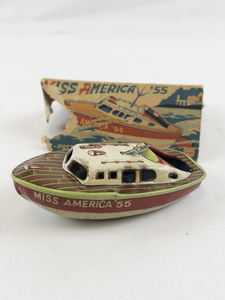 lot 172 image: 1955 Miss America Putt Putt Cabin Cruiser Tin Toy Car with Original Box.
