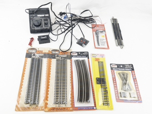 lot 185 image: Lot of Model Train Parts Bundle - Track, Transformer, & More