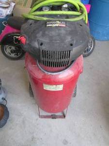 lot 13 image: Coleman Powermate 15-gallon upright...