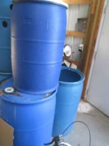 lot 29 image: 2-55gallon & 1-35gallon plastic bar...