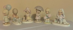 lot 193 image: Precious Moments Figurines including Cheers to the Leader, To a Very Special Mom, April and More