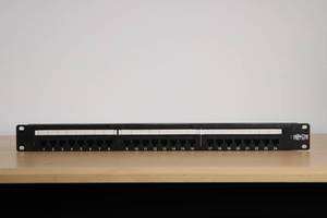 lot 14 image: Tripp Lite 24-Port Cat6Cat5 Patch Panel  MSRP $150