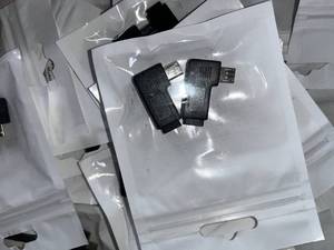 lot 27 image: Box of Right and Left 90° Micro USB Adapters  MSRP $2.99 ea