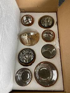 lot 61 image: Set of 8 Amber Glass Votives with Textured Finish