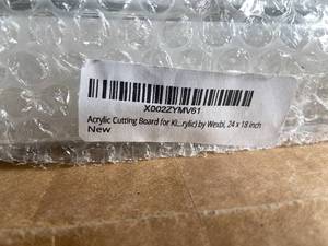 lot 63 image: Unopened Acrylic Cutting Board by Wexbi, 24 x 18 inch