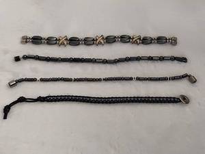 lot 110 image: Three Magnet Bracelets & One String Bracelet