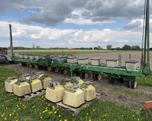 lot 18 image: John Deere 7100 12 Row Planter Finger Pickup