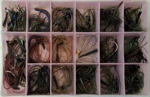 lot 12 image: 17 Tray Tackle Box Loaded with new and used bass jigs
