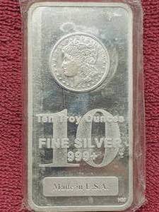lot 69 image: 10 Troy Oz .999 Silver Bar Morgan Dollar Design in Original Pkg