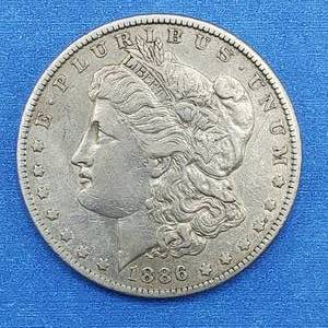 lot 98 image: 1886-O Morgan Silver Dollar Higher Grade