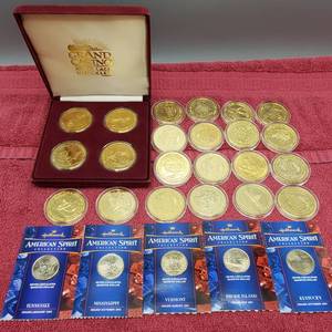 lot 410 image: 22 Grand Casino Tokens in Airtites & 5 State Quarters