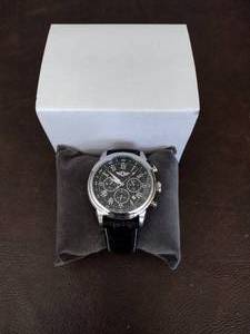 lot 29 image: Invicta watch New in box and watch case for displaying watches.