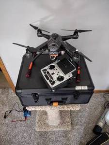 lot 24 image: Scout X4 drone with devention deco F12E remote in case