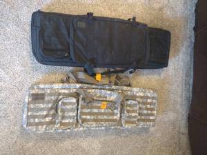 lot 104 image: Cabelas camo gun case and black 5.11 VTAC gun case