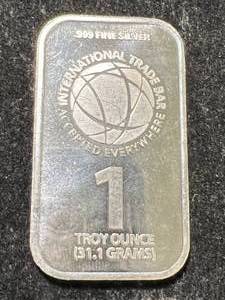 lot 06 image: 1 TROY OZ .999 FINE SILVER INTERNATIONAL TRADE BAR