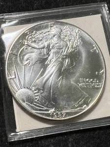 lot 12 image: 1987 AMERICAN SILVER EAGLE 1 TROY OZ .999 FINE SILVER
