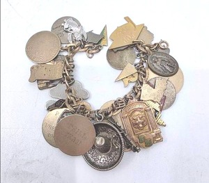 lot 91 image: Mixed Metal Charm Bracelet including 10K, 12K and 925 - 111.2 grams
