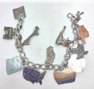 lot 104 image: Sterling Silver Charm Bracelet- 39.19 grams