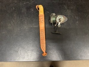 lot 81 image: Repala Fish N Filet Knife having Leather Sheath, Birch Handle and Stainless Steel Blade made by Martiniini in Finland and Fishing Reel