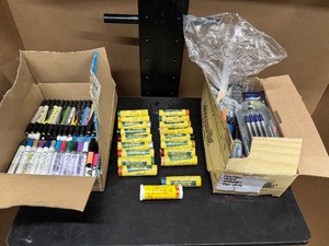 lot 85 image: All Weather Paint Stick Livestock Markers, Prism Color, Decocolor Pain Pens, Painters Markers and Box of New and Used Pens and Markers
