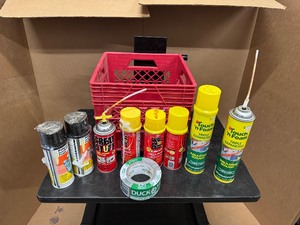 lot 98 image: Eight Cans of Insulation Foam and a Roll of New Duck Brand Duct Tape