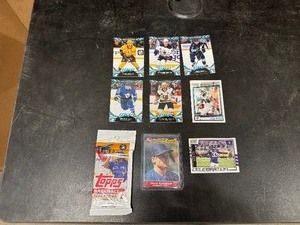 lot 99 image: Sports Cards - Tops 22 Baseball Series Sealed Pack, Chuck Knoblauch Rookie Star Card, Delvin Cook and Bonus Cards