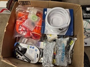lot 113 image: Mega Lot of Electronics, Plumbing Repair Pieces, Misc Hardware, Bike Stand, Chicken Feeding Apparatus, Plus More, most in Original Packaging