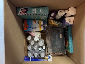 lot 114 image: Large Lot of Personal Care, Decor, Books-Fifty Shades of Gray Book Set, Soap, Face Oil, Scented Room Sprays, Hand Sanitizer, Face Shields, New Leather Gloves, Glass Golf Bookends and More