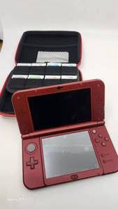 lot 86 image: Nintendo 3DS XL Kit with 8 Games Including Super Mario Bros