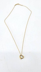 lot 26 image: Beautiful Tiffany & CO Elsa Peretti Open Heart Pendant Necklace in 18k Yellow Gold