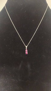 lot 104 image: Very Pretty Graduated Triple Ruby and Sterling Silver Pendant Necklace - 16