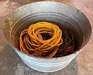 lot 54 image: Large Galvanized Tub with Assorted Extension Cords