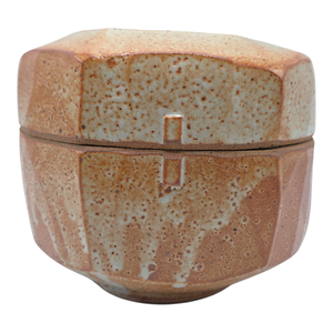 lot 9 image: Warren MacKenzie Shino-Glazed Lidded Jar  5 34 H x 7 12 W $3,000 Retail