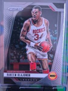 lot 168 image: HAKEEM OLAJUWON 2024 PANINI PRIZM LEGENDS
