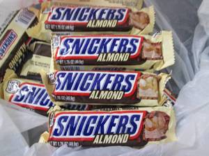 lot 82 image: 12- 1.76 oz  Almond Snickers...