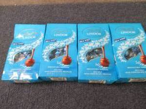 lot 96 image: 4- 5.1 oz Lindor Sea Salt Truffles...