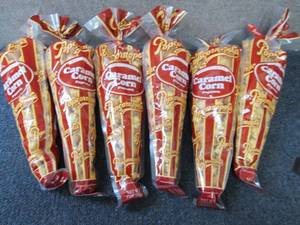 lot 180 image: 6- 7 oz Popcornopolis Carmel Corn...