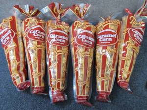 lot 181 image: 6- 7 oz Popcornopolis Carmel Corn...