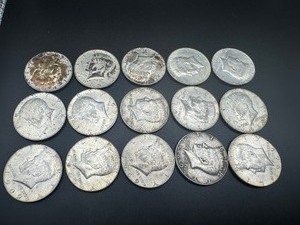 lot 59 image: Twelve 40% Silver Kennedy Half Dollars
