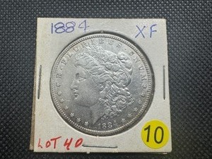lot 10 image: 1884 Morgan Silver Dollar - Marked XF When Purchased