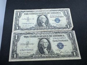 lot 98 image: 1935 D Blue Seal $1.00 Silver Certificate and 1957 Blue Seal $1.00 Silver Certificate