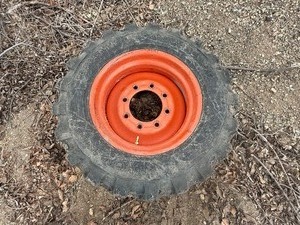lot 17 image: Skidsteer Spare Tire & Rim 10-16.5