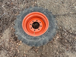 lot 18 image: Skidsteer Spare Tire & Rim 10-16.5