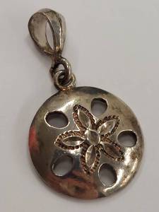 lot 98P image: Sterling Silver Pendant with Floral Cutout Design